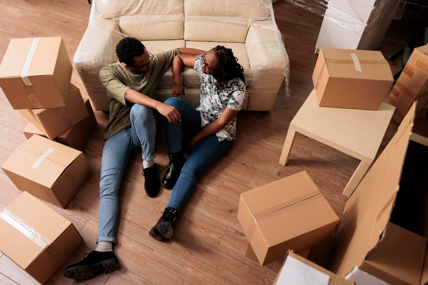 Young homeowners relaxing in their new smaller home