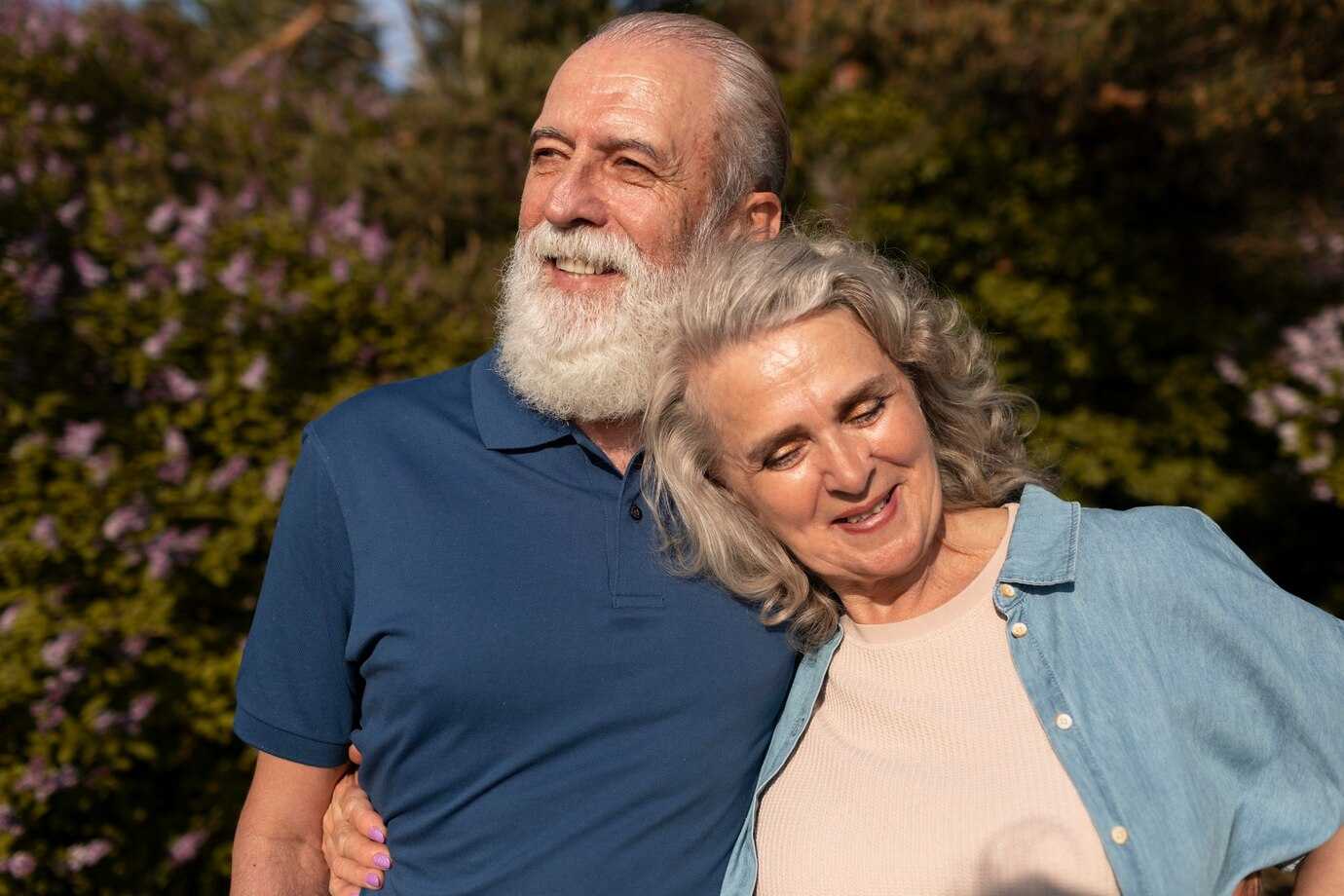 Smiling couple outside their new smaller home