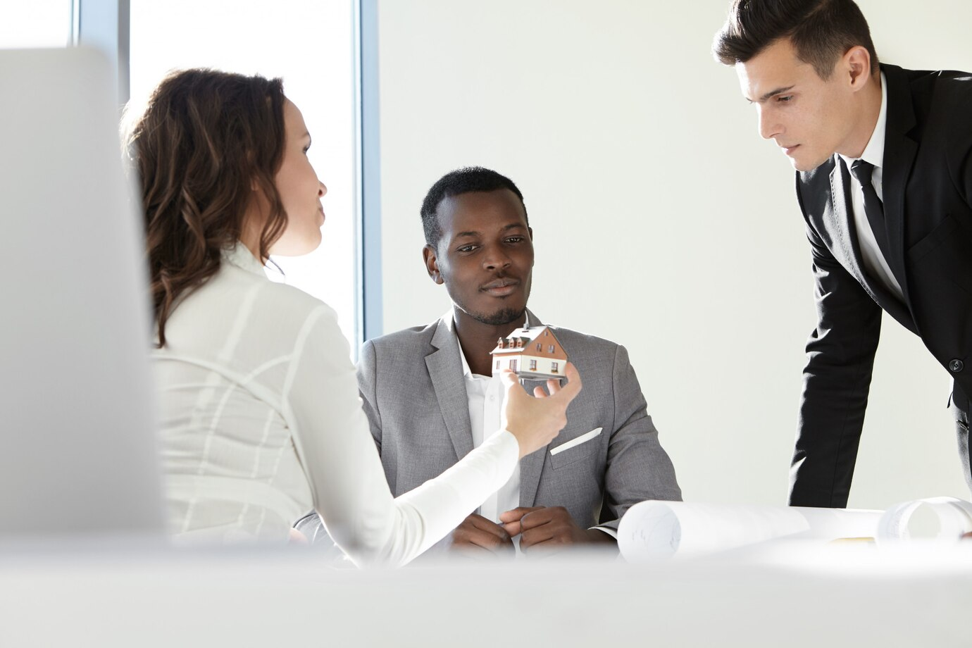 Group of real estate professionals meeting in an office